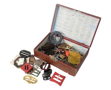 A collection of early 20th century buckles to include a gilt metal snake buckle, a chrome and bakelite buckle stamped LW Pari