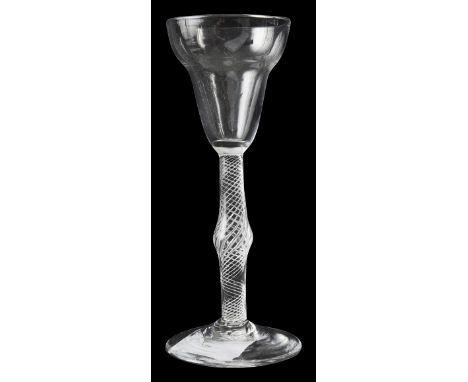 A mid 18th century pan top airtwist wine glass c.1755the round funnel bowl on a multiple spiral single series stem with centr