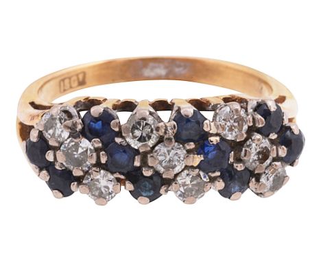 A sapphire and diamond ring set with alternate lines of circular-cut sapphires and brilliant-cut diamonds, the bifurcated sho