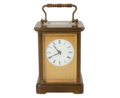 A Matthew Norman brass carriage clockthe white enamel face within a engine turned mask, the case with four bevelled glass sid