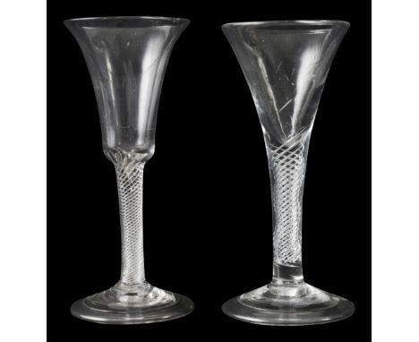 Two mid 18th century airtwist wine glasses c.1745first with  bell shaped bowl on a multi spiral stem second drawn trumpet bow