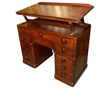 A Victorian mahogany architect's tablecirca 1840of freestanding kneehole form, the ratchet adjustable top above an arrangemen