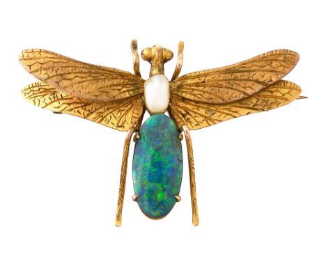 A late 19th century/early 20th century gem-set insect brooch the dragonfly with outstretched engraved yellow gold double wing