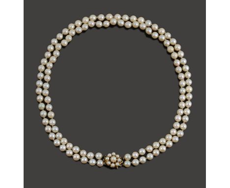 A double row cultured pearl necklacethe cultured pearls of even size and with 9ct gold clasp fastening with pearl cluster det