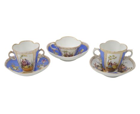 Two late 19th century Helena Wolfson Dresden twin handled chocolate cups and saucers and a cabinet cup and saucer of quatrefo