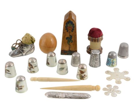 A collection of silver and other sewing items comprising an Edwardian novelty pin cushion in the form of a lace up shoe or bo