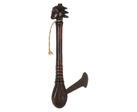A Luba ceremonial hardwood axe or kibiki/kasoluraDemocratic Republic of Congothe base carved with a female head, the handle p
