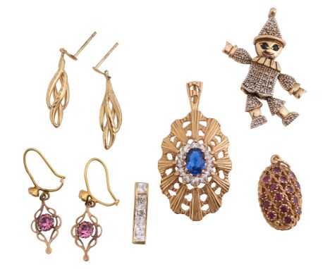 A group of gold pendants a 9ct gold sapphire and gem set flexible clown pendant, stamped '375'; a blue and colourless paste 9