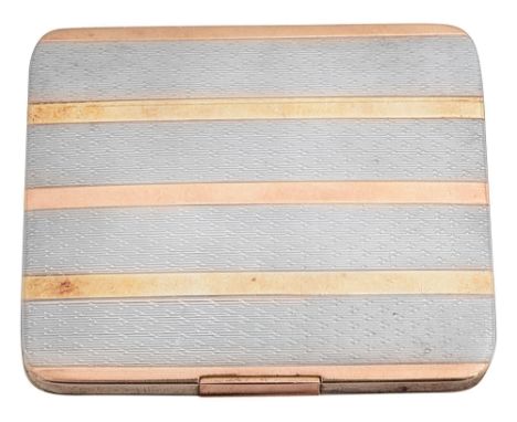 A George V silver and gold vesta caseLondon, 1912, Goldsmiths &amp; Silversmiths Co.of rounded rectangular form with engine t