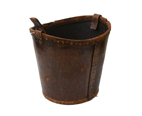 A 19th century brass studded leather fire bucketheight 31.5cmCondition: Strap handle absent. Leather worn and dry principally