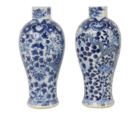 A pair of Chinese blue and white vases19th centuryof shouldered baluster form, decorated with twin dragons within foliate, pr