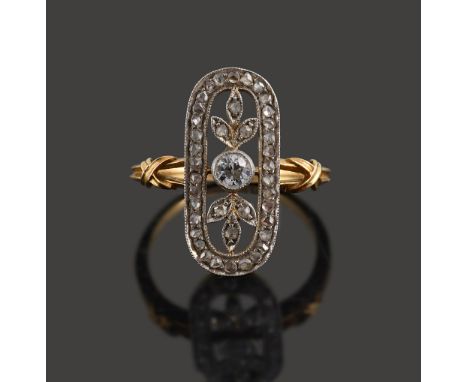 An Edwardian diamond-set ring,the openwork oval plaque centrally-set with an old brilliant-cut diamond to the old-cut diamond