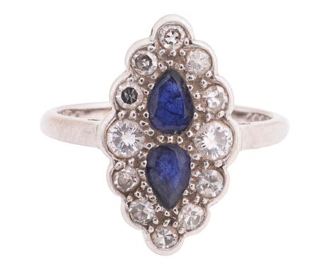 A sapphire and diamond-set ringthe navette-shaped cluster centrally-set with two addorsed pear-shaped sapphires to the border