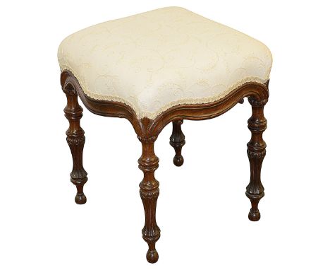 A William IV rosewood and upholstered stoolcirca 1830of serpentine outline, the moulded apron raised on ring turned beaded an