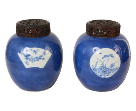 A pair of 19th century Chinese powder blue ginger jarsovoid tapering from decorated in Kangxi style with three round, fan and