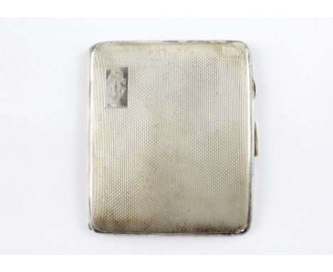 A George VI hallmarked silver engine-turned cigarette case with engraving to interior 'Presented to Claude B Southall on his 