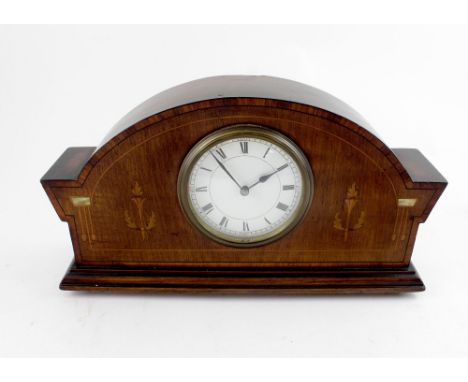 An early 20th century French mahogany inlaid mantel clock, white ceramic dial set with Roman numerals, 17 x 30cm.