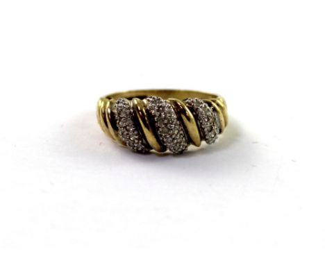 A 9ct yellow gold ladies' dress ring, pavé-set with diamonds on a twist, size R, approx 3.6g.