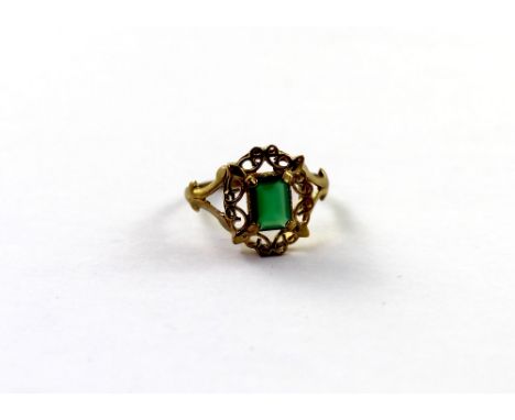 A 9ct yellow gold ladies' dress ring set with emerald-cut emerald, in scroll frame, size O, approx 2.4g.