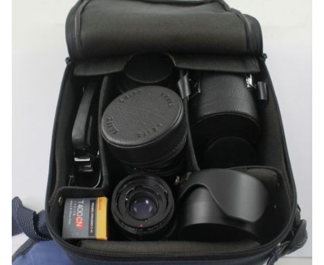 A canvas carrying case containing a cased Leitz Wetzlar 3270237 Elmarit-R1:2.8/28 lens, a Leitz Canada 2880379 SUMMLCRON-R 1: