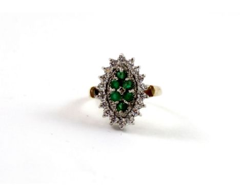 A 9ct yellow gold ladies' dress ring, marquise shape set with six emeralds and small diamonds, size L, approx 4g.