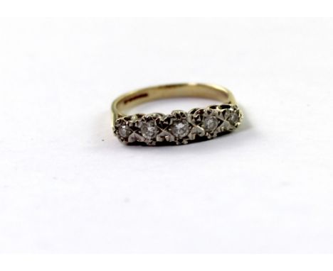 A 9ct yellow gold ladies' dress ring with five illusion-set diamonds, size O, approx 3.1g.