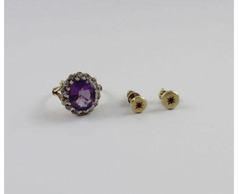 A 9ct yellow gold ladies' dress ring, central large amethyst and small white stone surround, size L and a pair of yellow meta