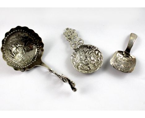 Three hallmarked silver caddy spoons, a Joseph Wilmore, George III, Birmingham 1822 example, a James Dudley, London 1896 exam