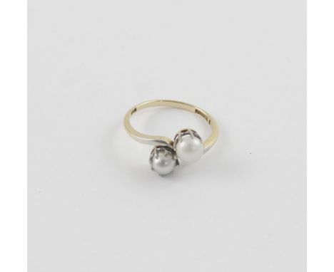 An 18ct yellow gold ladies' dress ring set with a grey and white pearl on a twist, size L, approx 2.9g.