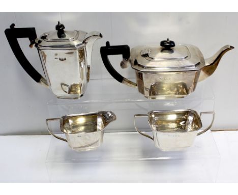 A George VI hallmarked silver Art Deco four-piece tea service, teapot, sucrier, milk jug and hot water pot, Britton, Gould &a