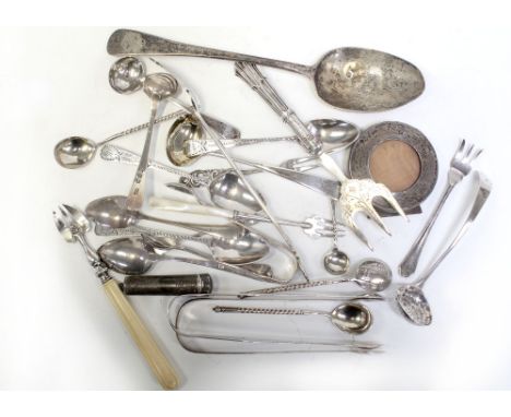 A quantity of hallmarked silver flatware to include sugar tongs, teaspoons, small ladles, sieving spoons, dessert spoon, pick