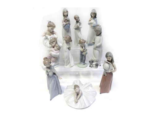 Eleven Lladró and Nao figures to include a curtsying ballerina, young girl holding baby, children in night clothes, seated ba