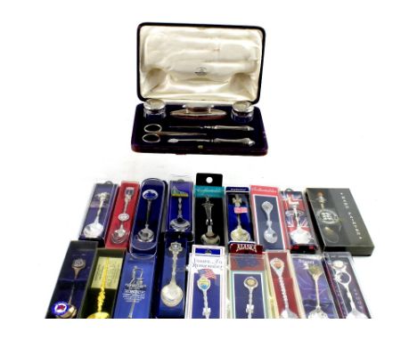 A cased hallmarked silver manicure set with small trinket pots, nail buffer and manicure items, Mappin &amp; Webb Ltd, date m
