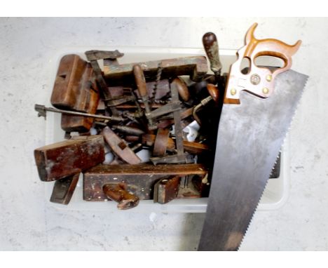 A quantity of vintage tools to include various planes, drills, saw, clamps, blocks, drill bits etc.