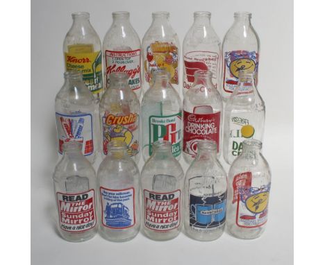 Over twenty vintage advertising milk bottles to include Kellogg's Corn Flakes, Cadbury's Later Tonight Drinking Chocolate, PG