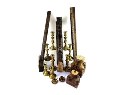 Five pairs of brass candle sticks, varying ages, some ecclesiastical, a carved pillar with praying angels, length 75cm and va