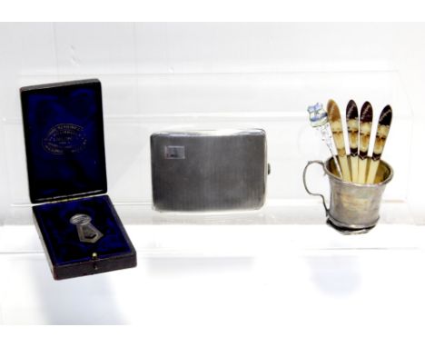 A George VI hallmarked silver engine-turned cigarette case, Birmingham 1937, a hallmarked silver Christening mug, marks rubbe