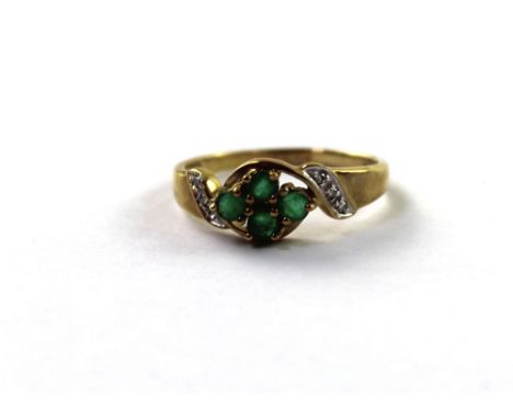 A 9ct yellow gold ladies' dress ring set with four small emeralds and tiny diamonds set to the shoulders, size P, approx 2g.