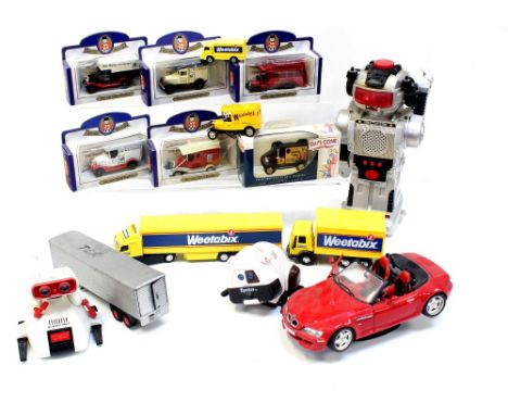 A quantity of Days Gone vintage model collectors' cars to include Model T Ford Van Mackintosh's, the Daily Telegraph Newspape