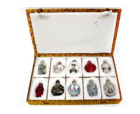 A cased set of ten snuff bottles, to include resin, glass, ceramic and hand-painted examples (10).