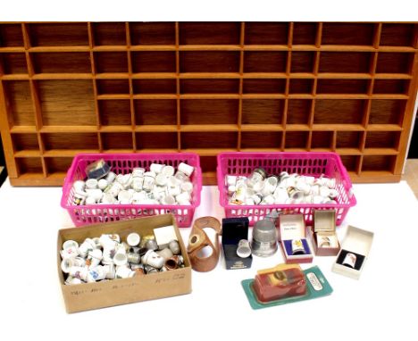A large wall-hanging thimble display case, 80 x 34cm, a smaller wall-hanging display case and a large quantity of ceramic, wh