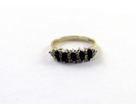 A 9ct yellow gold eternity ring set with small sapphires and diamonds, size M, approx 2.6g.