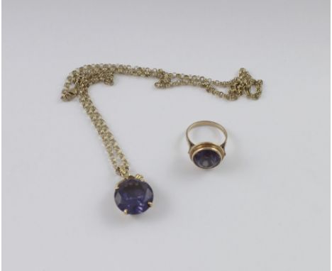 An 18ct gold mounted alexandrite pendant marked 18K to the clasp, diameter of stone approx 17mm, on 9ct belcher link chain an