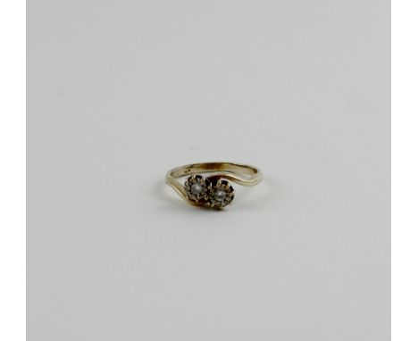 A yellow metal illusion-set chip diamond crossover ring, hallmarks rubbed, size N, approx 2.5g.
