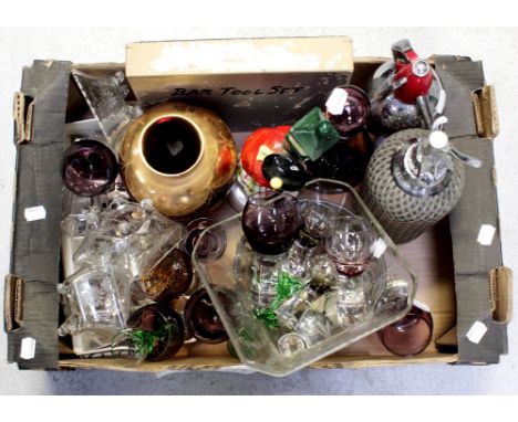 A vintage amethyst glass decanter with six matching glasses, vintage crystal liqueur glasses with green twist stems, a Caithn