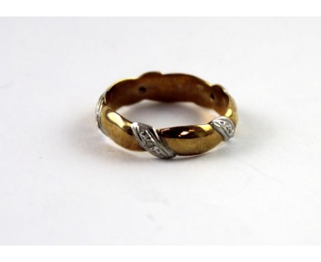 A 9ct yellow gold ladies' dress ring, the band spiral-set with small diamonds, size N, approx 2.6g.