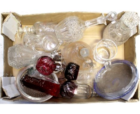 A quantity of assorted glassware to include a claret jug with plated collar, top and handle, various cut glass decanters, bub