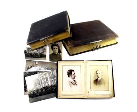 Three Victorian and Edwardian photograph albums containing a quantity of portrait photographs and cabinet cards, some taken i