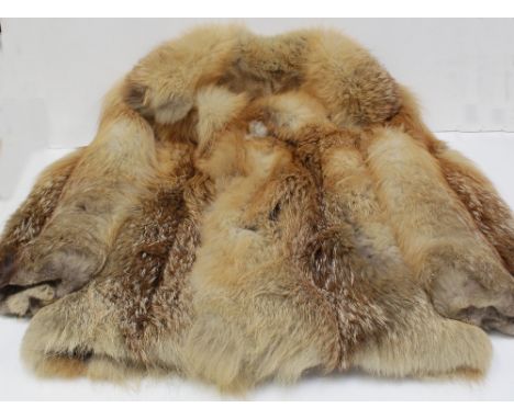 A vintage red fox fur jacket. CONDITION REPORT Hanging strap needs re-stitiching, some stains to the lining, generally good t