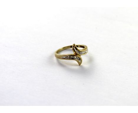 A 9ct yellow gold ladies' dress ring set with baguette and small diamonds, size R, approx 2.7g.